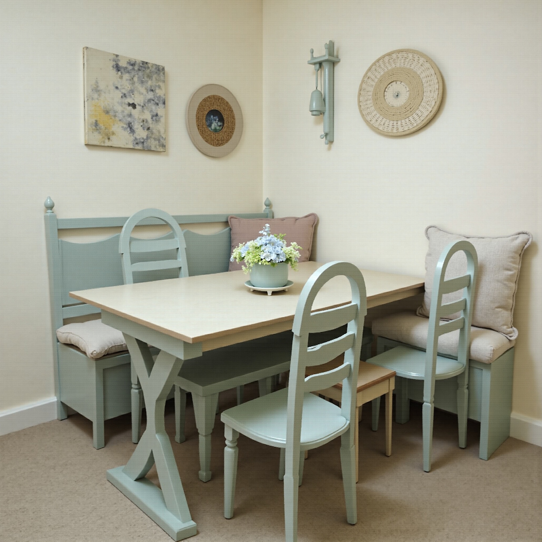 AI generated image by FLUX.1-image-to-image: ponle cojines a bancos arcones y sillas, crea un rincon de comedor diario, que trasmita calma, que sea natural de estilo shabby chic, con alma de campo francés y utiliza colores complementarios al azul, por ej coral empolvado,tonos verdes suaves. la mesa dejala de color madera. y crea un lugar para la maquina de cafe/desayuno